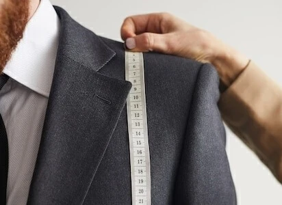 Custom suit measuring shoulder